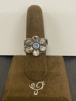 SS Flower with 1X Blue Topaz Ring Size 7.5
