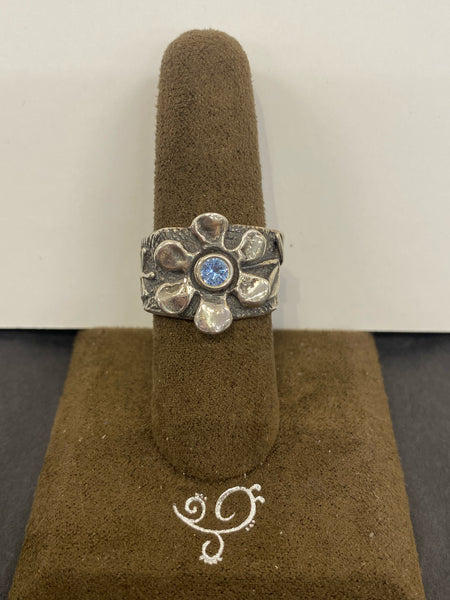 SS Flower with 1X Blue Topaz Ring Size 7.5